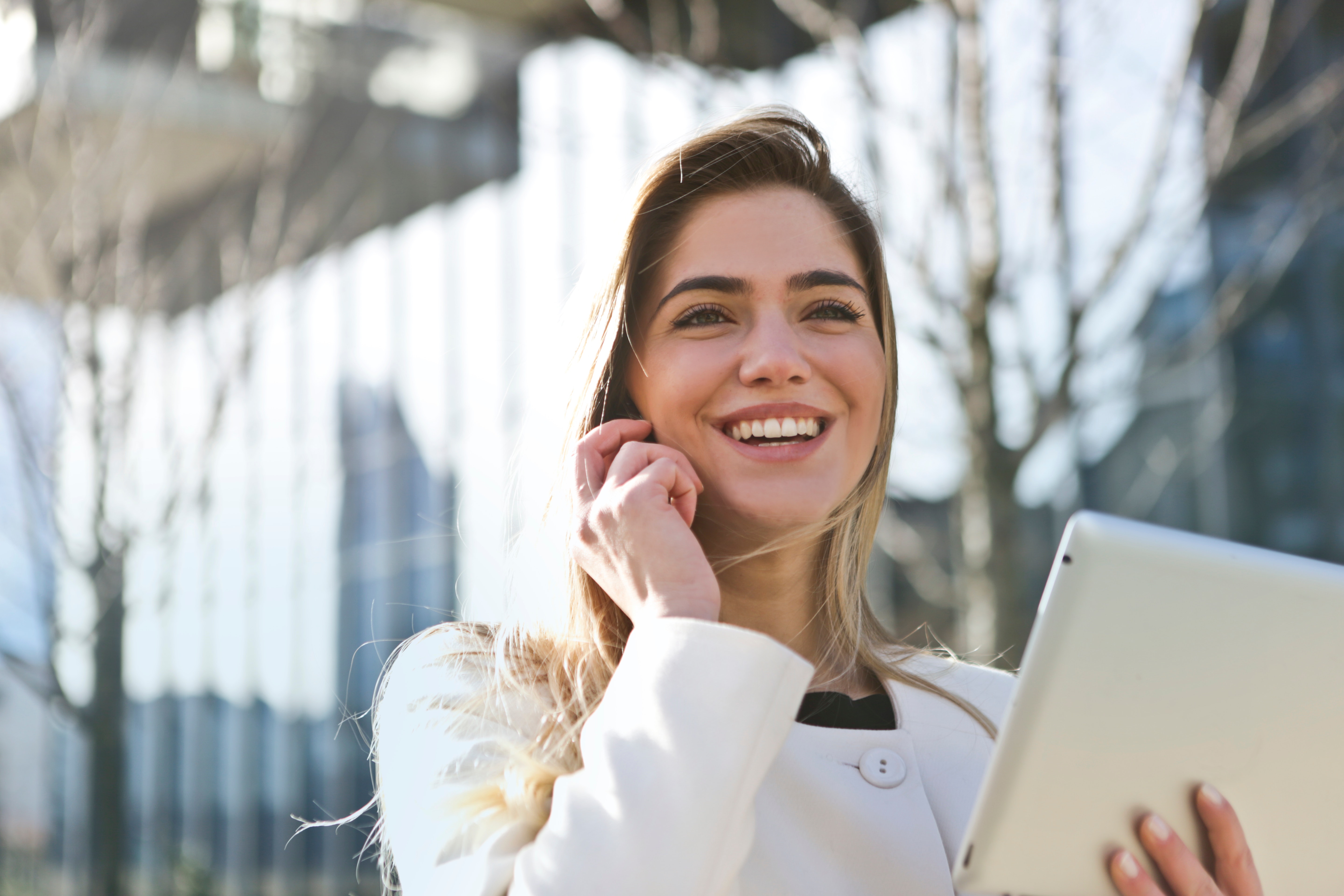 Blonde woman smiling on the phone