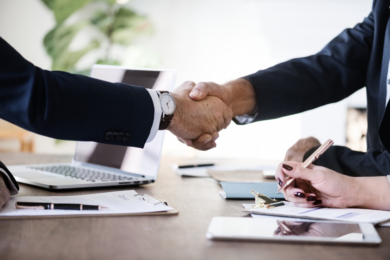 two business people shaking hands networking