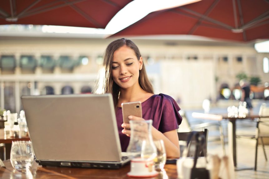 woman with laptop in cafe